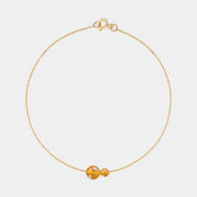 Gold bracelet with two asymmetrical Baltic ambers by Adele Notes.