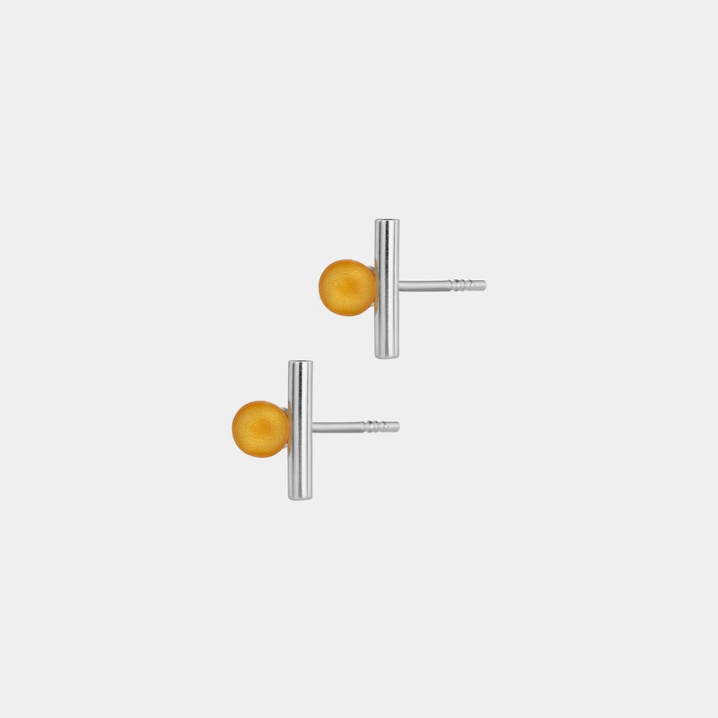 Silver earrings by Adele Notes, featuring a band and small Baltic amber element.