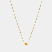 Gold necklace with small Baltic amber pendant by Adele Notes.