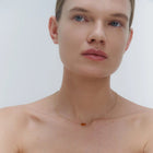 Gold necklace with two asymmetrical Baltic amber pendants by Adele Notes. 