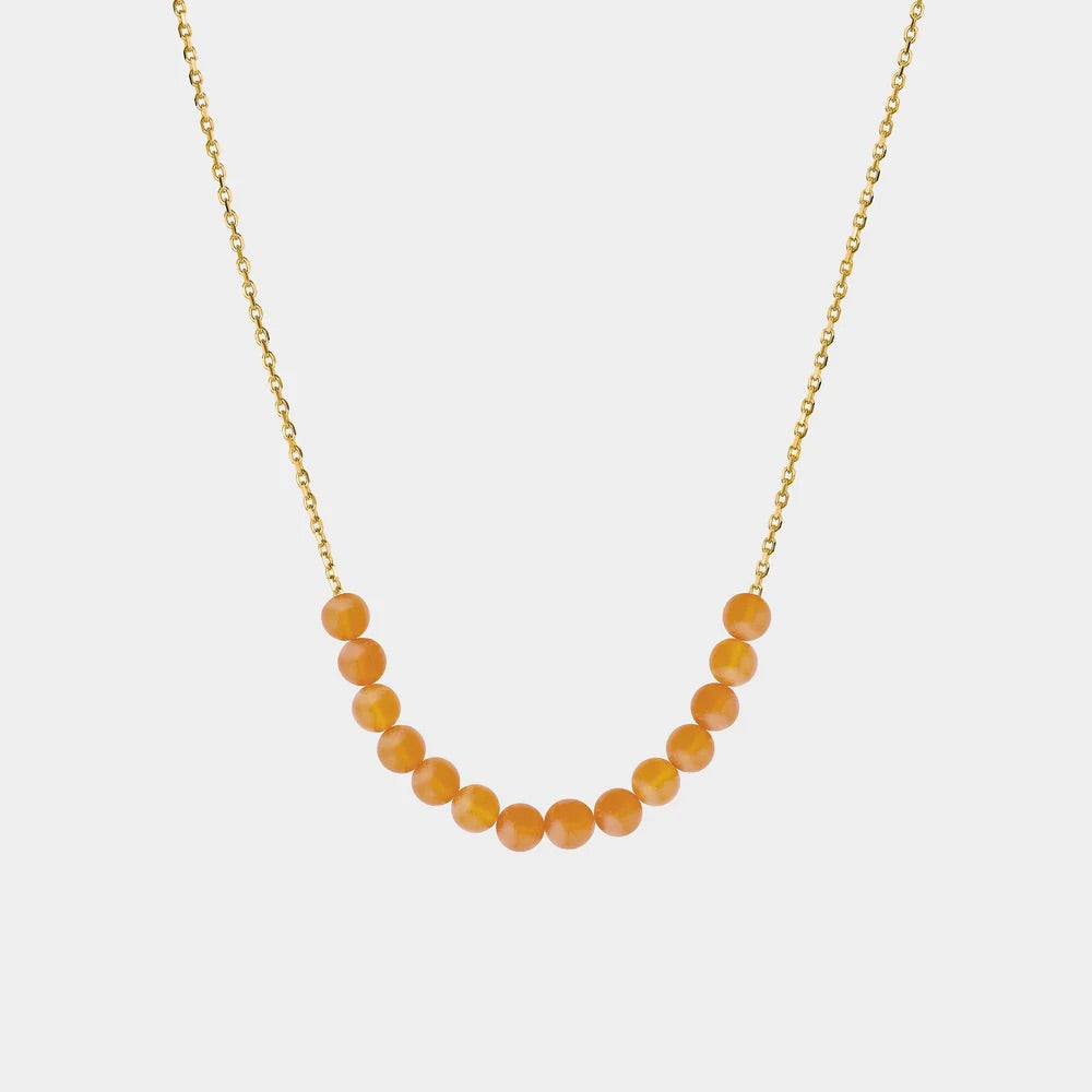 Necklace with Baltic amber beads on a white background