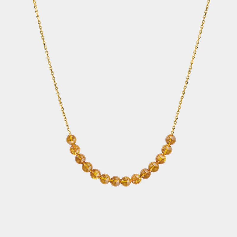 Necklace with Baltic amber beads on a white background