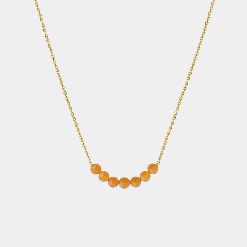 Necklace with Baltic amber beads on a white background
