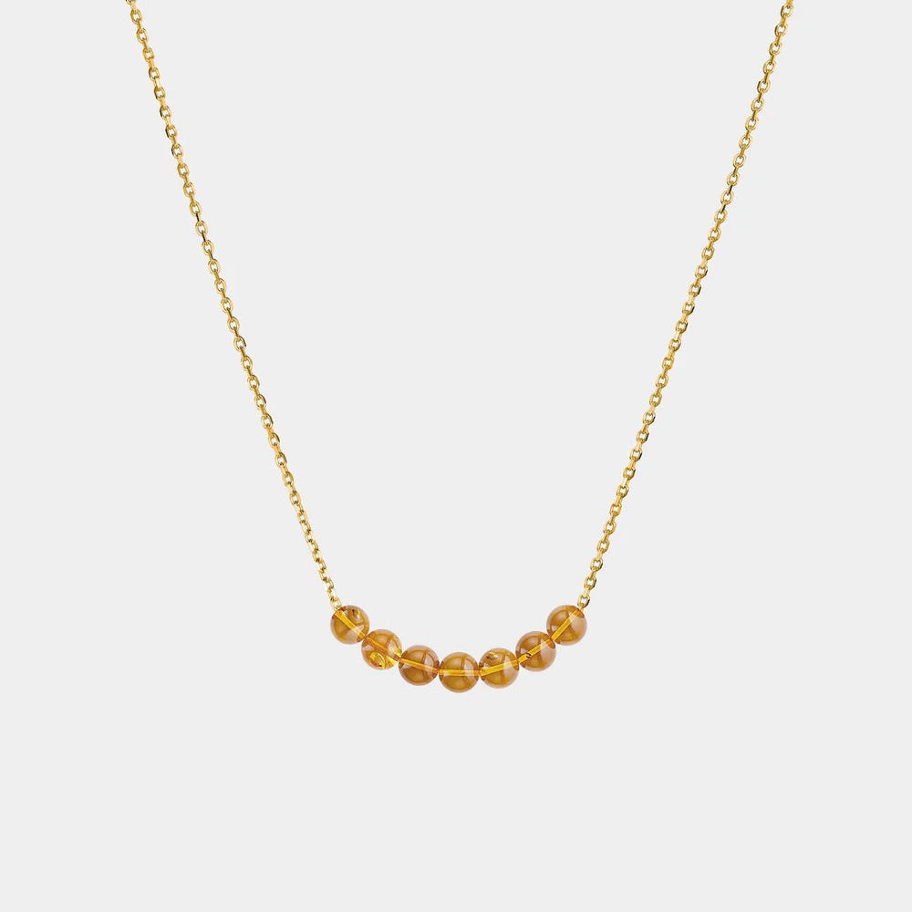 Necklace with Baltic amber beads on a white background