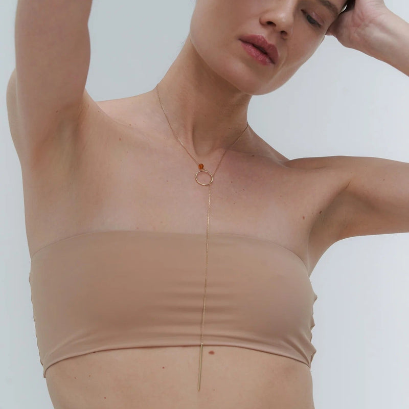 Gold necklace with Baltic amber by Adele Notes. 