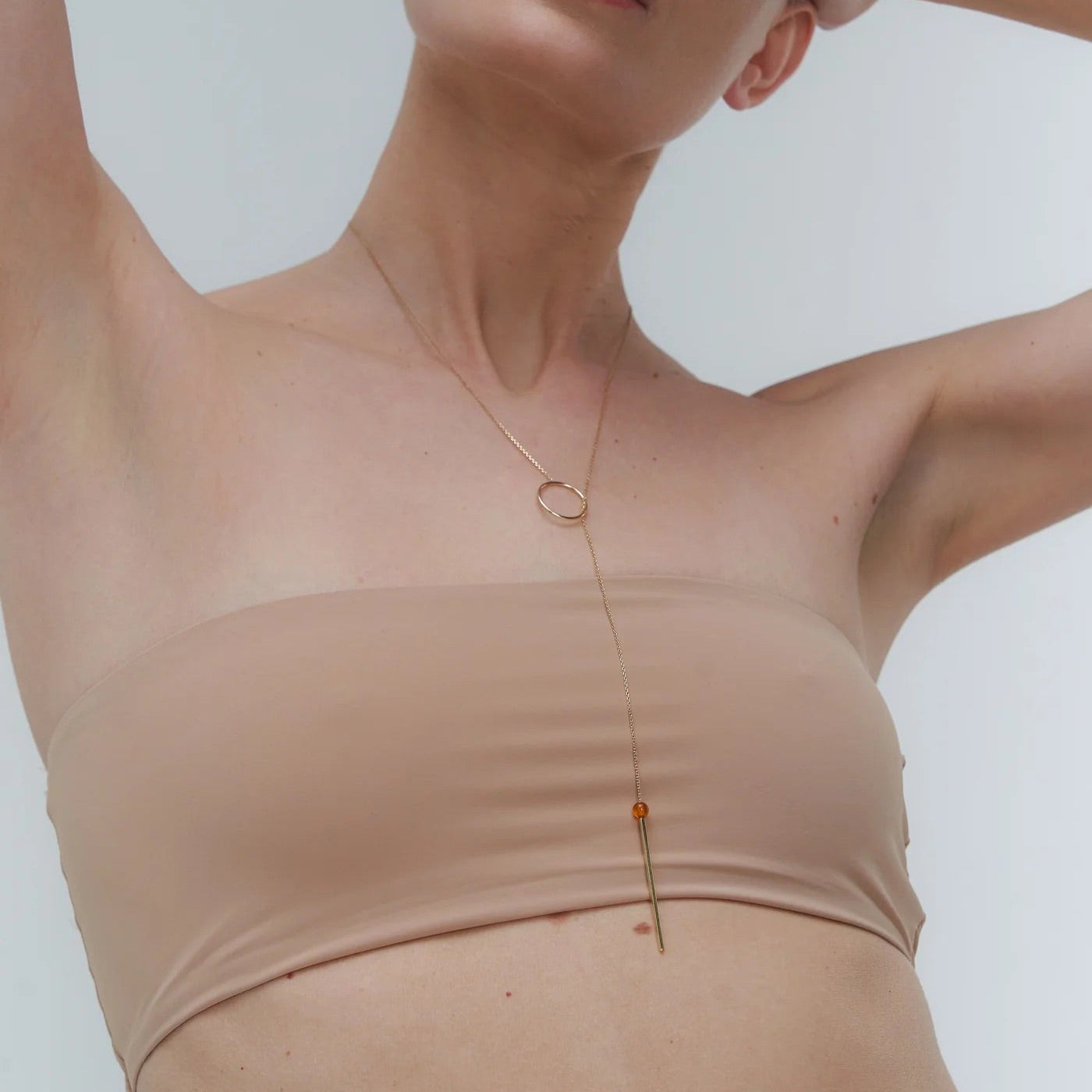 Gold necklace with Baltic amber by Adele Notes. 