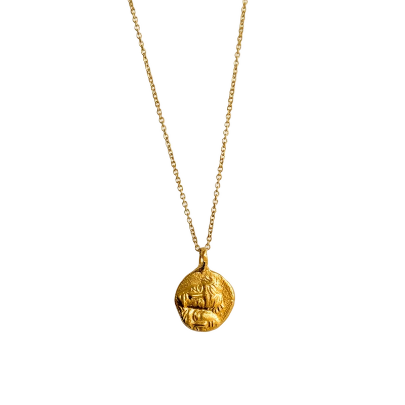 24kt gold-plated coin pendant with faces.