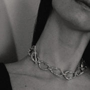 Gold-plated bronze necklace featuring an organic chain of irregular, textured links with a molten-inspired finish.