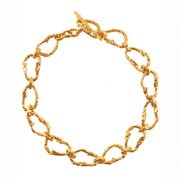 Gold-plated bronze necklace featuring an organic chain of irregular, textured links with a molten-inspired finish.