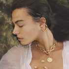 Gold-plated bronze necklace featuring an organic chain of irregular, textured links with a molten-inspired finish.