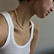Woman wearing a freshwater pearls & gold necklace