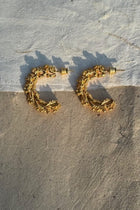Gold-plated silver hoop earrings with an organic, coral reef inspired texture.