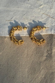 Gold-plated silver hoop earrings with an organic, coral reef inspired texture.