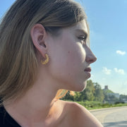 Gold-plated silver hoop earrings with an organic, coral reef inspired texture.
