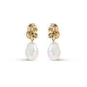 A pair of gold-plated silver earrings featuring a large, wavy stud and a baroque freshwater pearl attached to it.