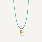 A gold plated silver necklace with a heart-shaped pendant on a green string.