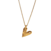 Gold heart-shaped pendant necklace on a white background
