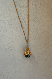 Gold-plated silver pendant with dark pearl by Near Me.