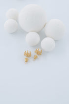 Gold-plated silver earrings set with Akoya pearls. 