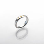 Polished sterling silver ring with Latin inscription, featuring a smooth band with engraved text.