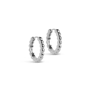 A pair of large silver hoop earrings with a ball pattern texture, displayed against a white background