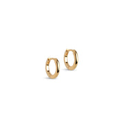 A pair of small gold huggie hoop earrings on a clean white background.