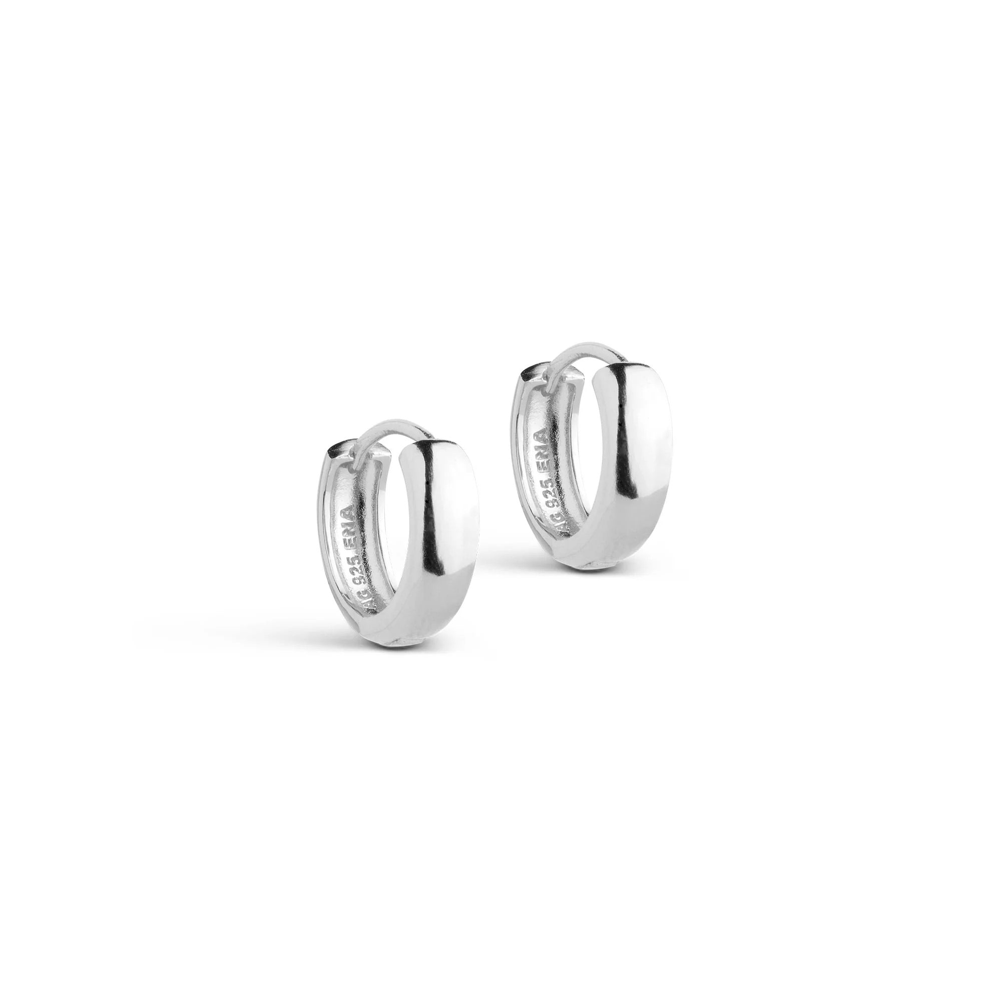 Pair of silver hoop earrings on a white background