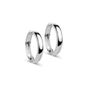 Pair of silver hoop earrings on a white background