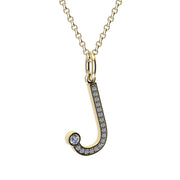 Gold and diamond necklace with letter 'J' pendant on a white backgroun
