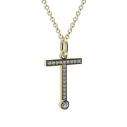 Gold and diamond necklace with letter 'T' pendant on a white background