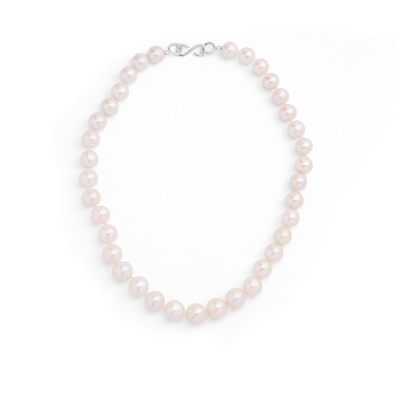 A necklace composed of round freshwater pearls and fine sterling silver.