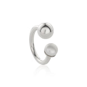 Open-band silver ring featuring asymmetrical ends with silver sphere and freshwater pearl. 