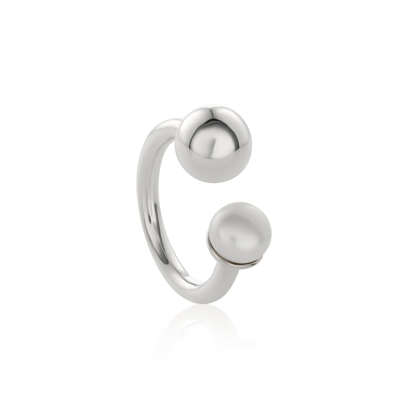 Open-band silver ring featuring asymmetrical ends with silver sphere and freshwater pearl. 