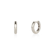 Pair of white gold hoop earrings on a white background