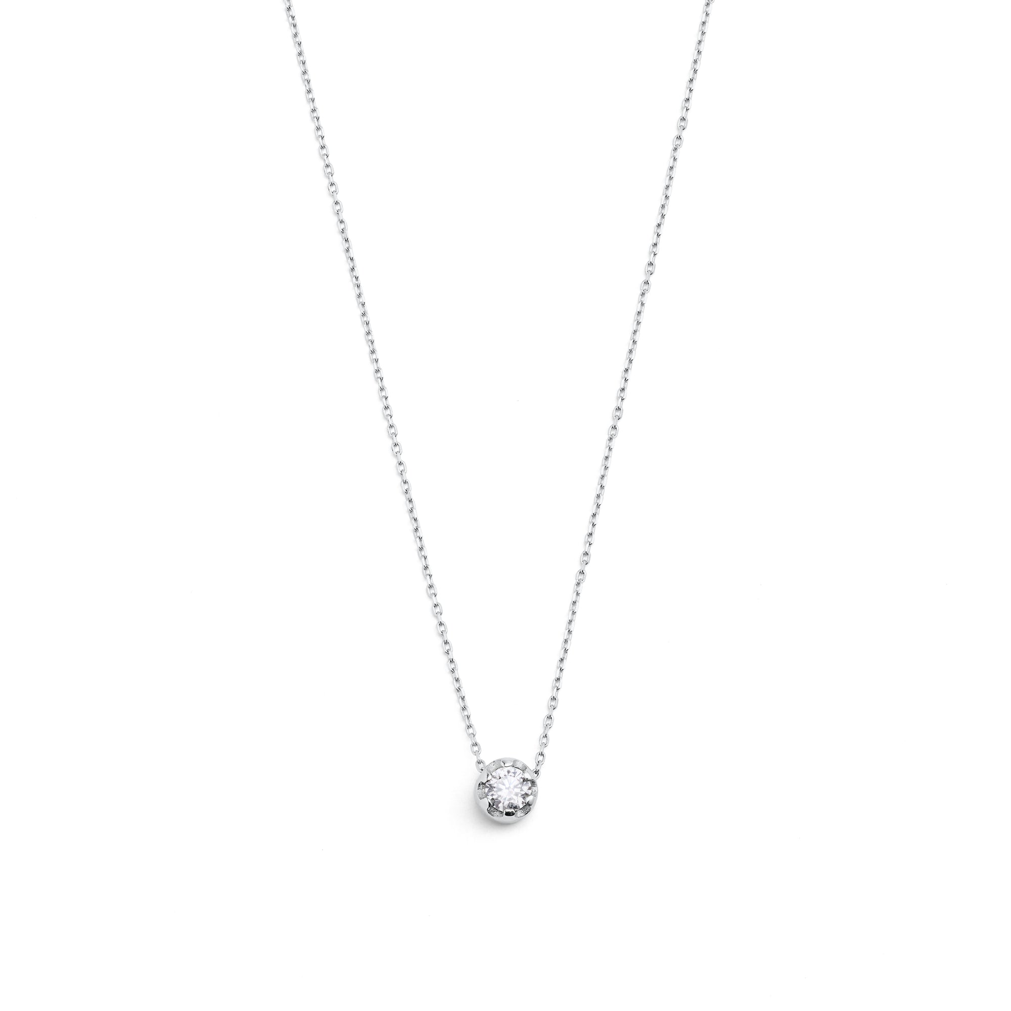 White gold pendant featuring a round brilliant-cut diamond, suspended from a delicate gold chain. 