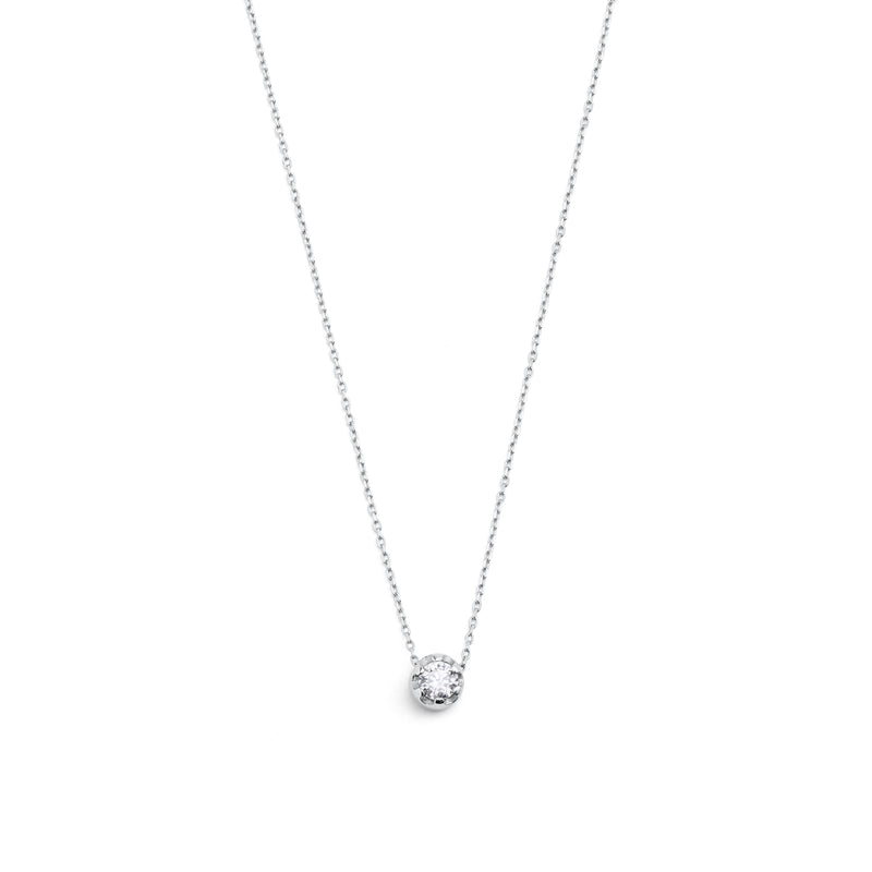 White gold pendant featuring a round brilliant-cut diamond, suspended from a delicate gold chain. 