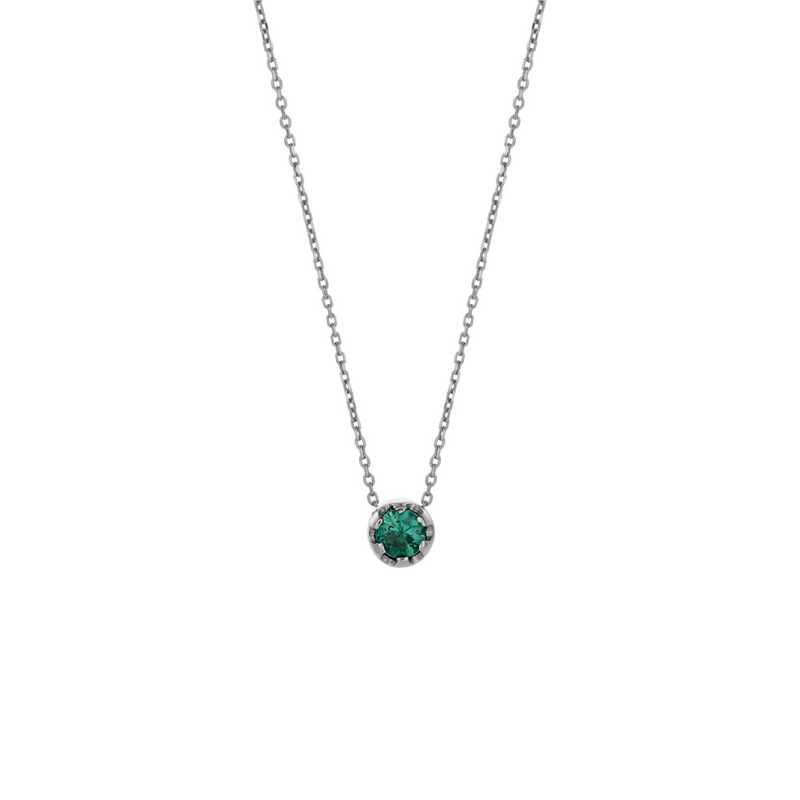 White gold pendant featuring a round emerald, suspended from a delicate gold chain. 