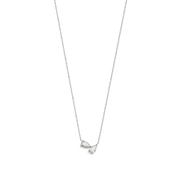 A white gold necklace with two pear-shaped diamonds, displayed against a white background.