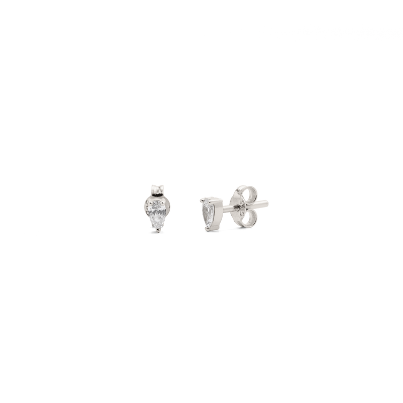 A pair of white gold stud earrings with pear-shaped diamonds, viewed from the front on a white background.