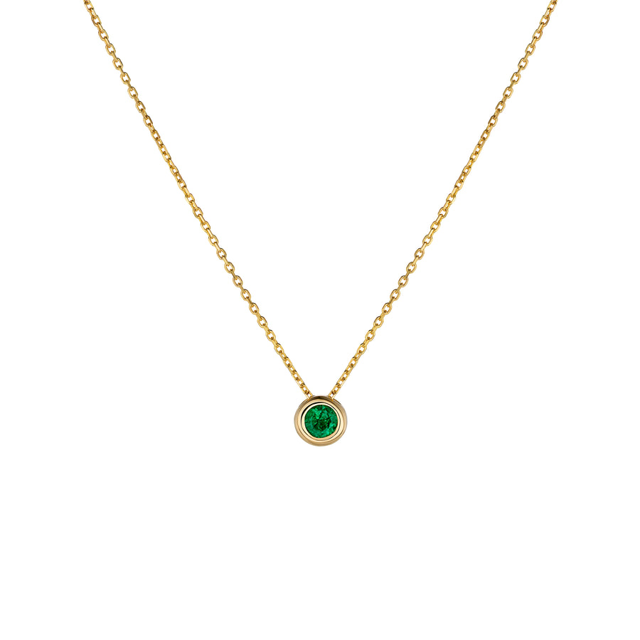 Yellow gold necklace with emerald pendant on a white background