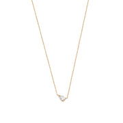 A 14k yellow gold necklace with a pear-shaped diamond centerpiece, on a white background.