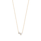 A 14k yellow gold necklace featuring two pear-shaped diamonds.