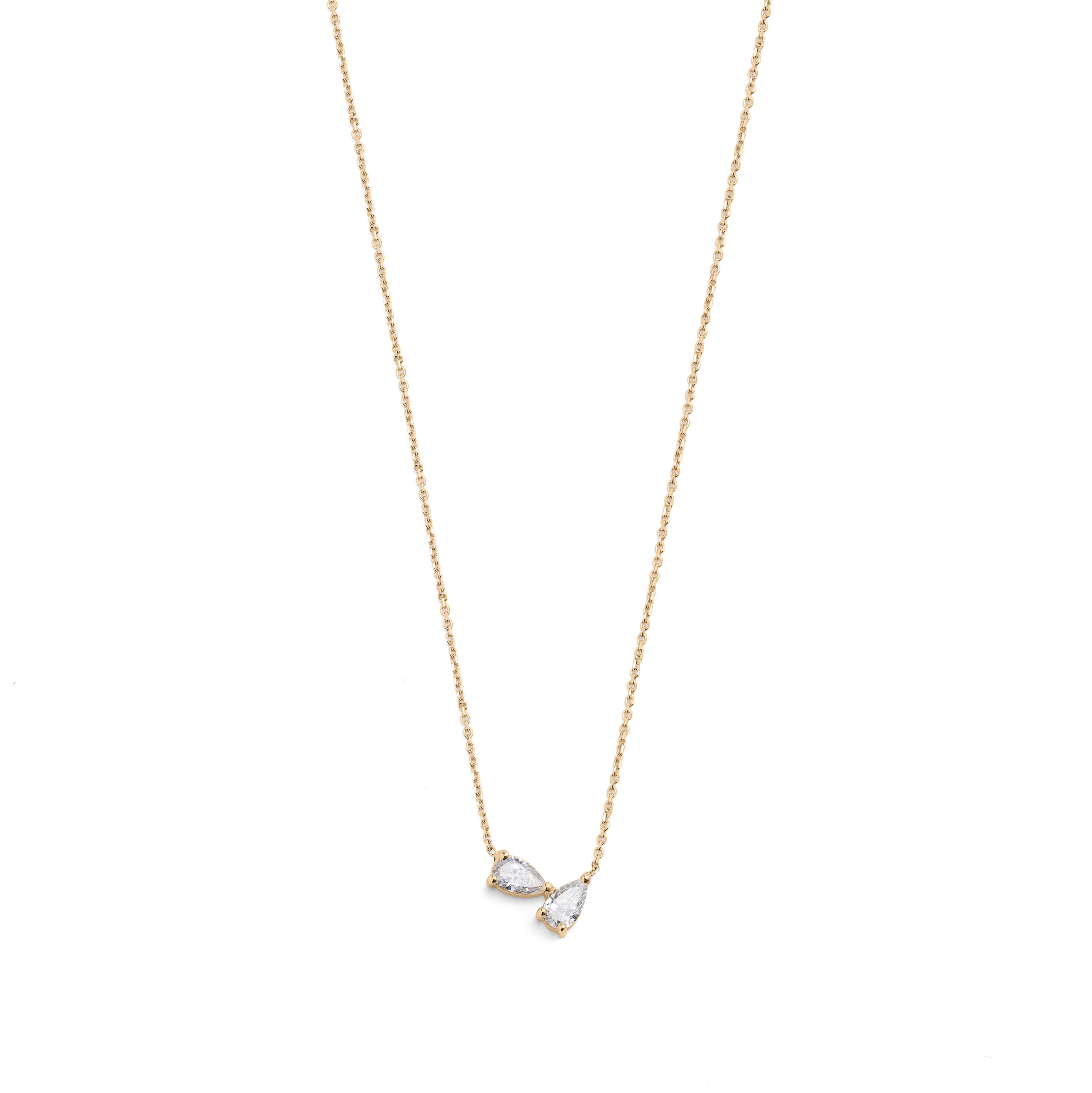 A 14k yellow gold necklace featuring two pear-shaped diamonds.