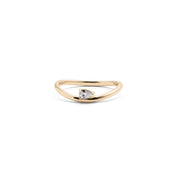 A 14k yellow gold ring with a pear-shaped diamond centerpiece.