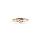 A 14k yellow gold ring with two pear-shaped diamonds set in the band.