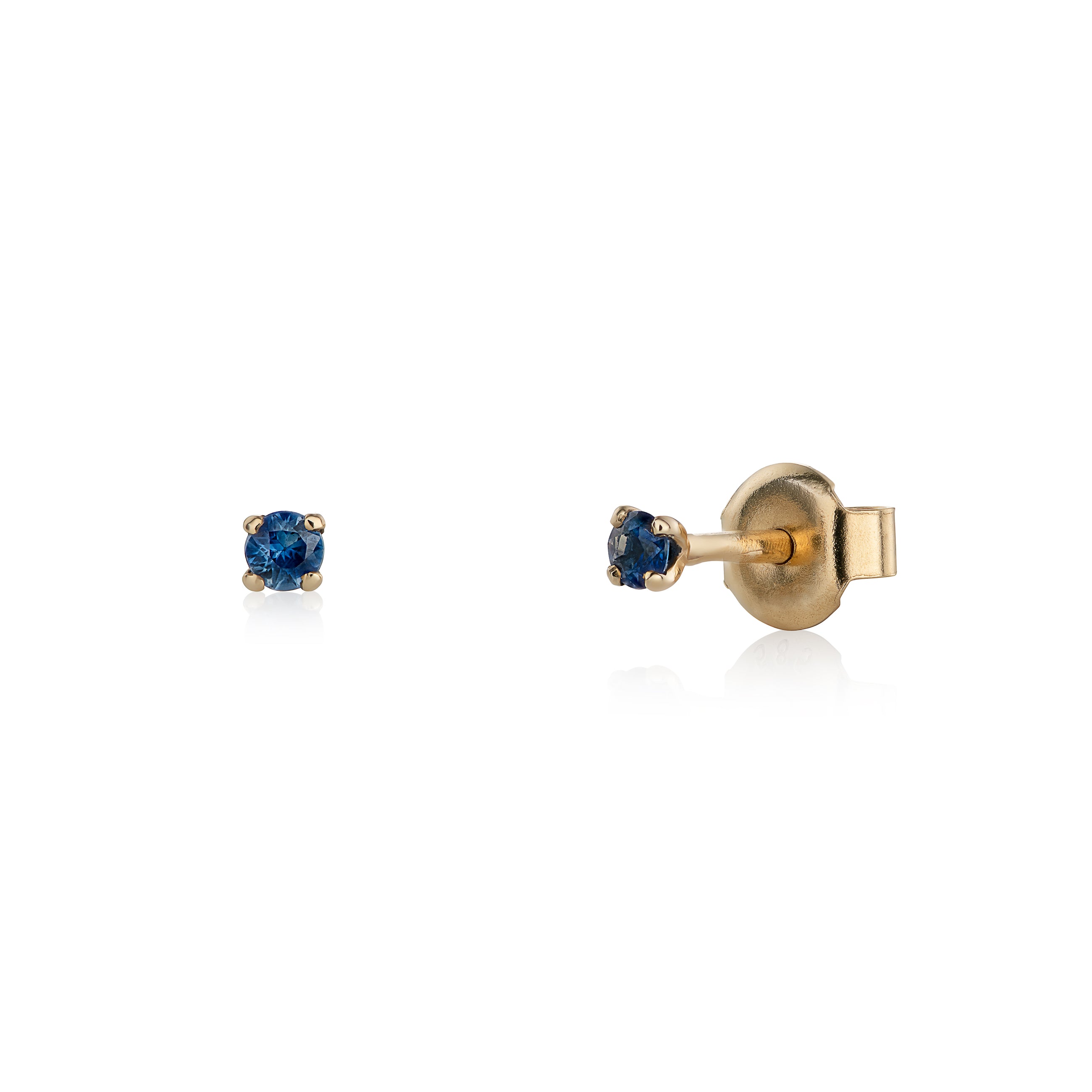 Yellow gold earrings with blue sapphires on a white background