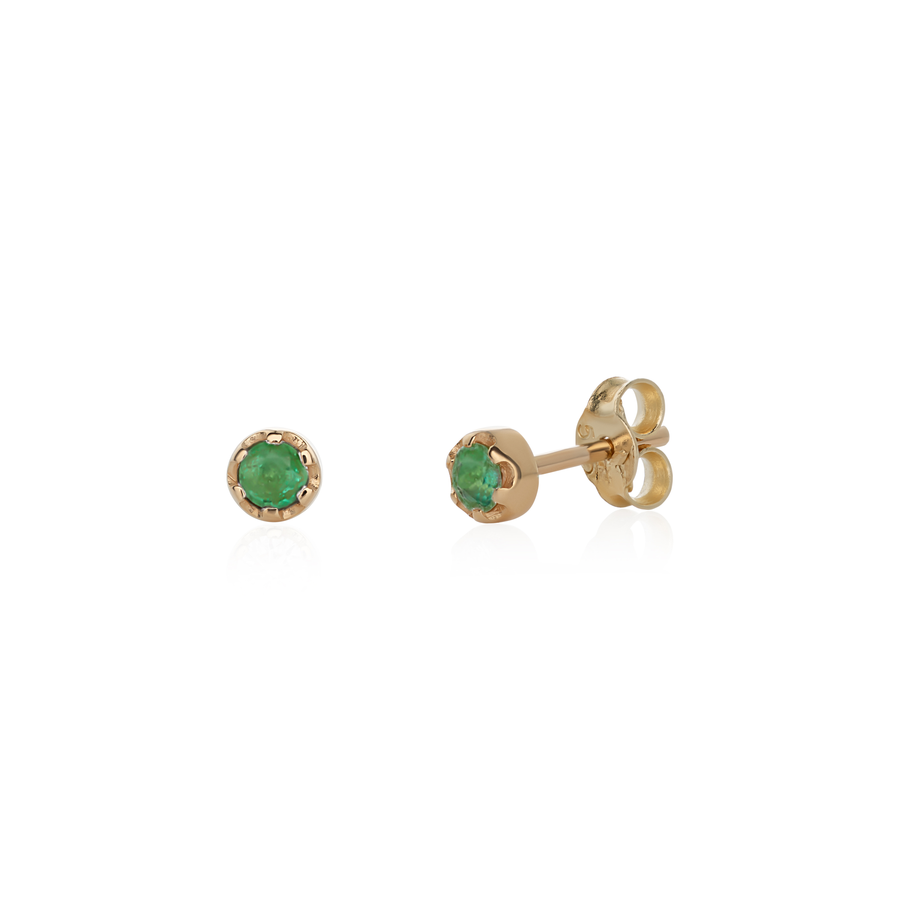 Stud earrings featuring round emeralds set in 14k yellow gold.