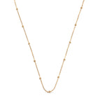 Gold chain necklace on a white background