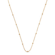 Gold chain necklace on a white background