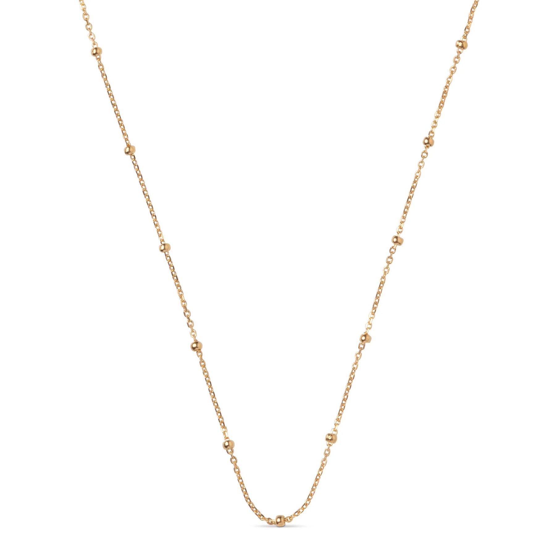 Gold chain necklace on a white background